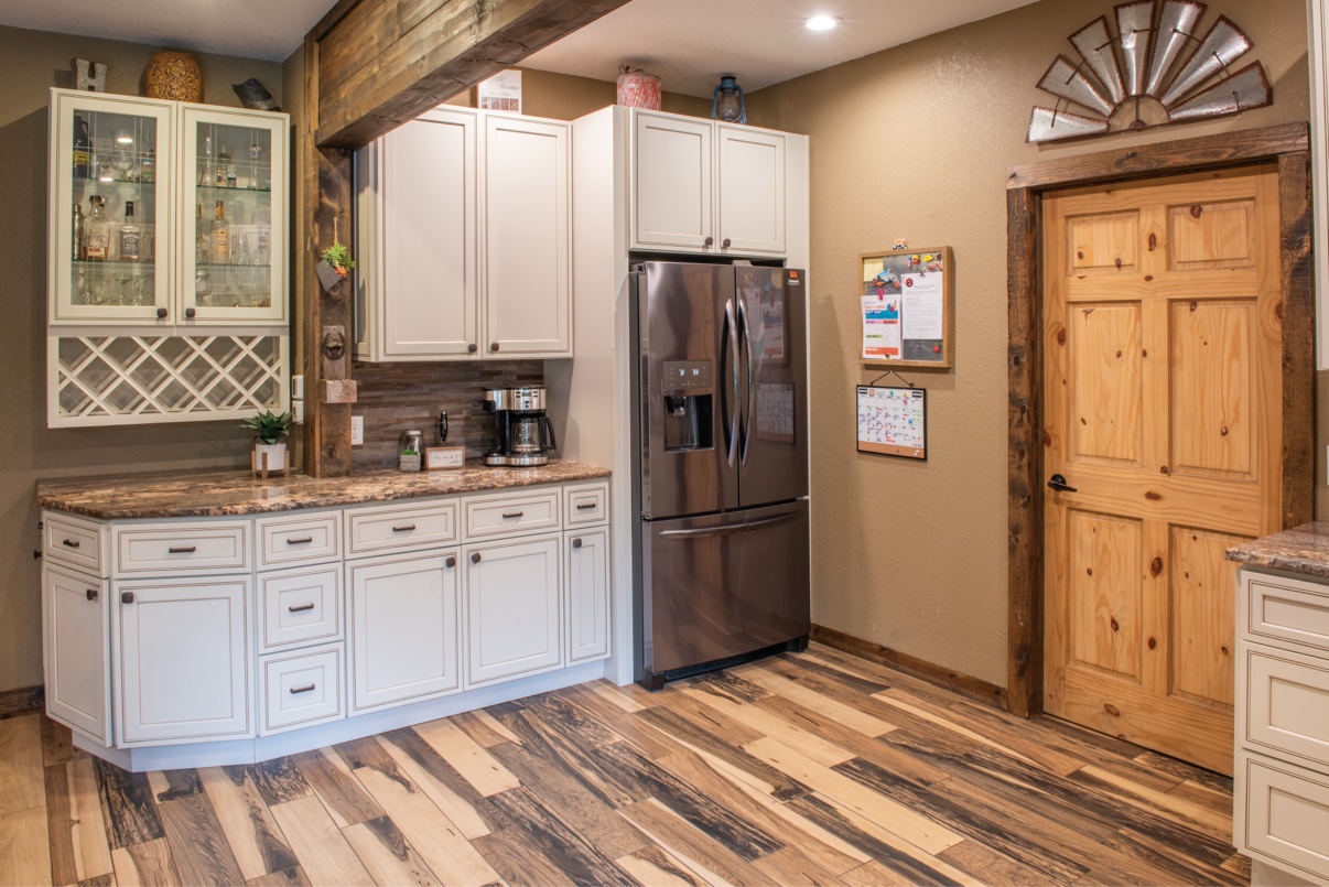 Kitchen cabinets, wine rack and refrigerator