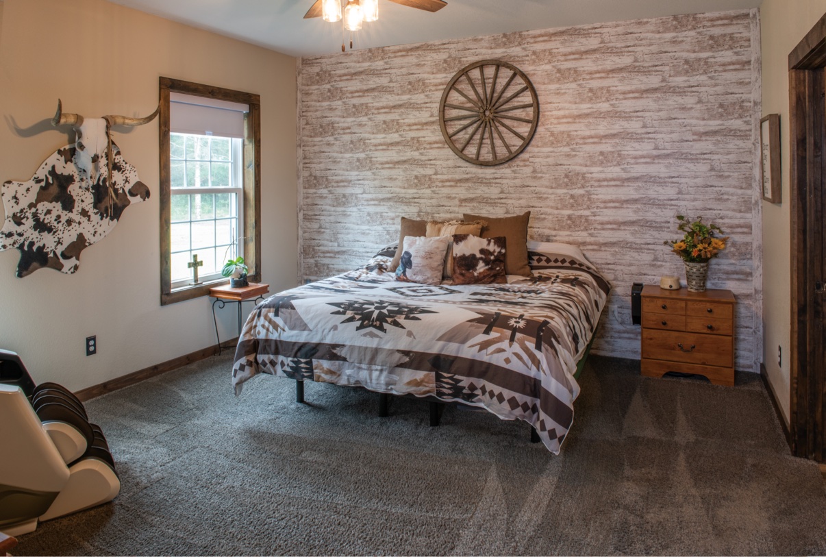 Primary bedroom with accent wall